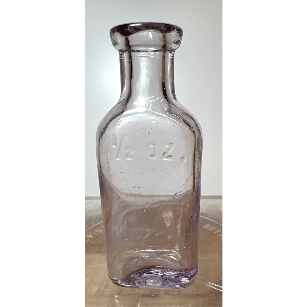 Vintage Clear Purple Tint Glass Bottle Embossed Apothecary Style